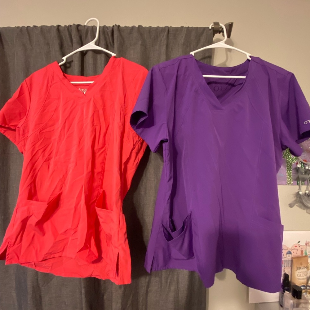 2 scrub tops, brand is BARCO ONE. Size Large.